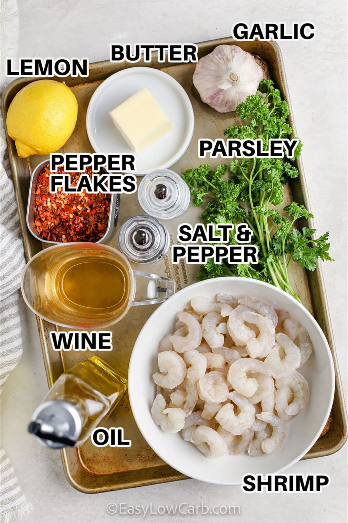 Easy shrimp scampi is a deliciously rich and buttery dish that combines perfectly cooked shrimp with fragrant garlic, a subtle touch of red pepper flakes for mild heat, and fresh parsley to brighten every bite, finished with a squeeze of lemon to balance the richness and create a restaurant-quality flavor experience that’s easy to make at home in under 30 minutes. #easylowcarb lemon , butter , garlic , parsley , red pepper flakes , salt and pepper , wine , oil , shrimp with labels to make Easy Shrimp Scampi