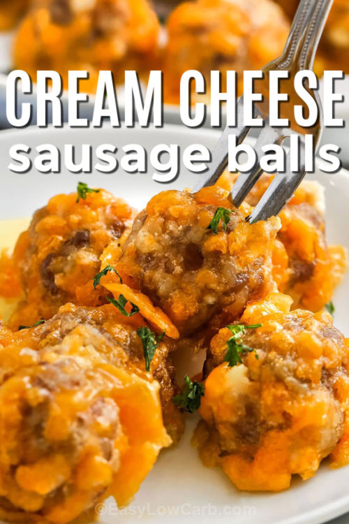 Cream Cheese Sausage Balls are a low-carb favorite made with sausage, cheddar, cream cheese, almond flour, and baking powder for a soft, flavorful bite. This easy recipe bakes quickly and works well for meal prep, parties, or simple snacks. Each bite is tender, cheesy, and savory, making these sausage balls a great option for anyone craving a satisfying low-carb appetizer or breakfast idea. #easylowcarb close up of plated Cream Cheese Sausage Balls with one on a fork and writing