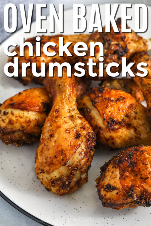 These oven-baked chicken drumsticks make a delicious low-carb dinner with minimal prep and bold smoky flavor. The combination of smoked paprika, garlic powder, and oregano creates a savory crust that crisps beautifully in the oven. This simple recipe is perfect for meal prep or busy nights when you want something satisfying without extra steps. Serve with low-carb sides like roasted broccoli or cauliflower mash for a complete meal. #easylowcarb close up of Oven Baked Chicken Drumsticks on a plate with a title