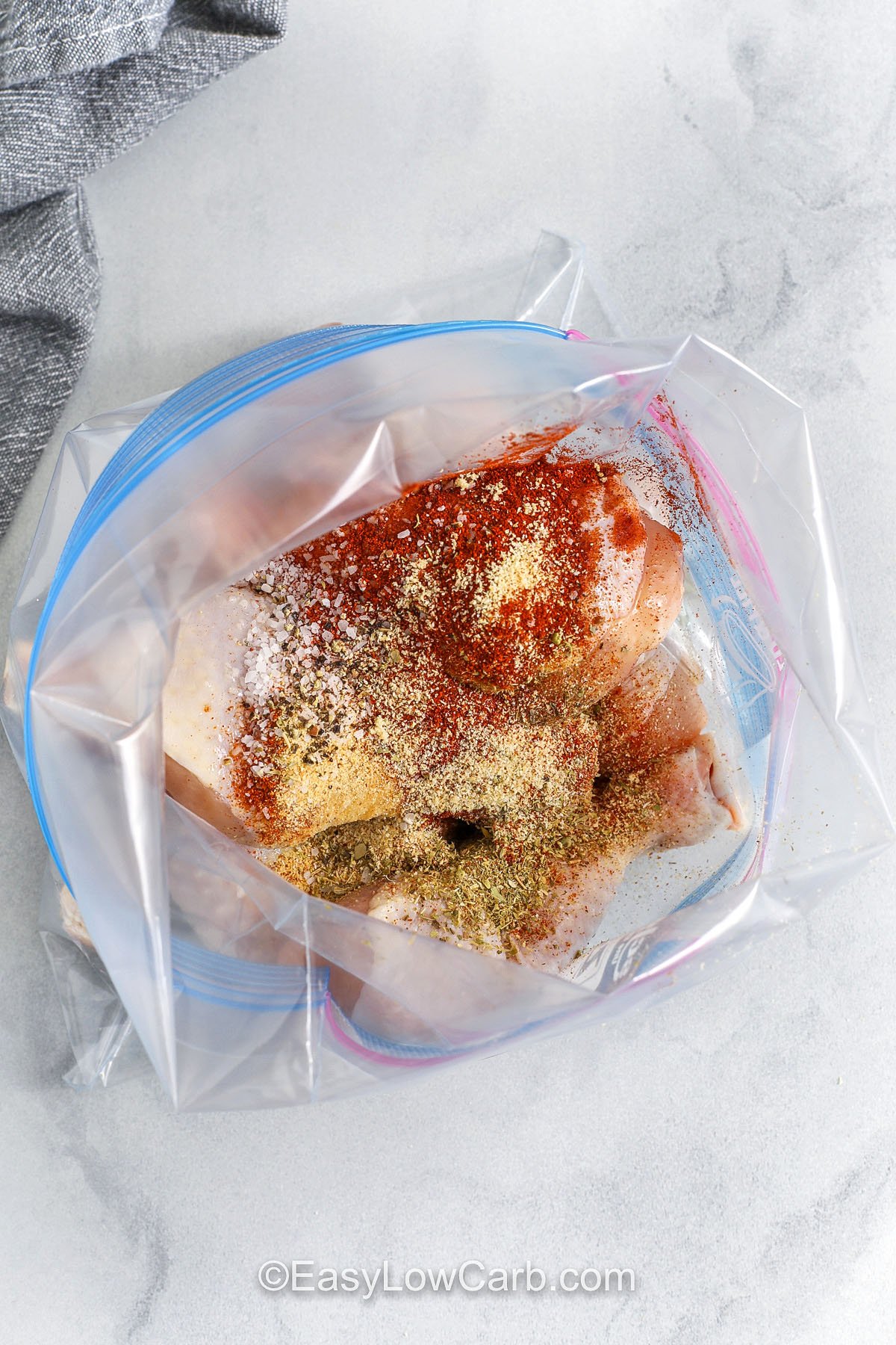 Oven baked chicken drumsticks get crisp on the outside and stay juicy inside with an easy low carb seasoning blend. Paprika and garlic bring rich flavor that builds as the chicken cooks at high heat. This recipe works well for quick dinners, meal prep, or serving with keto vegetables. It’s simple, budget friendly, and delicious every time. #easylowcarb adding seasonings to chicken to make Oven Baked Chicken Drumsticks