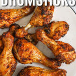 plate of Oven Baked Chicken Drumsticks with writing