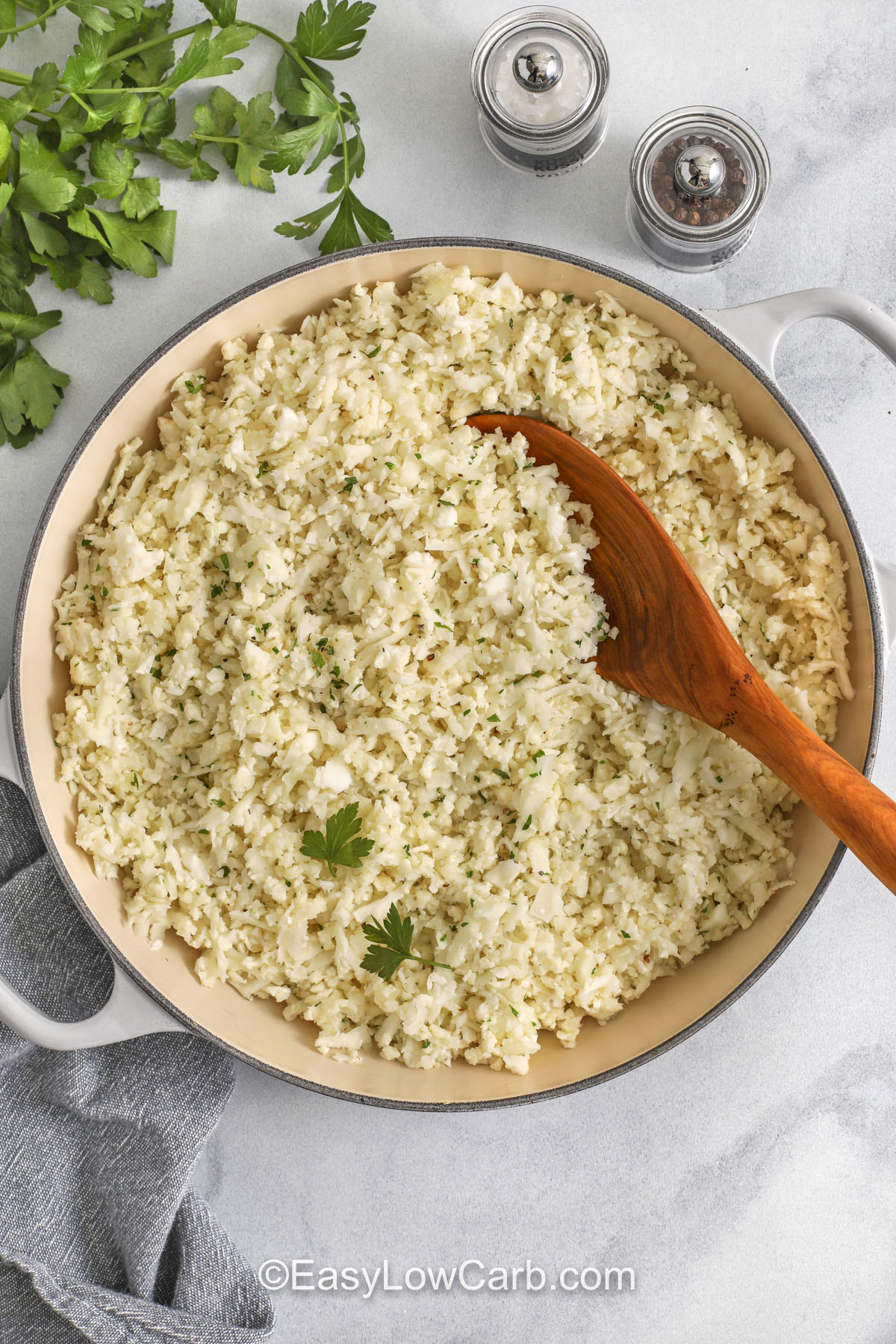 This stovetop Cauliflower Rice Recipe is a great way to enjoy a low-carb side dish that feels fresh and simple. With just a few ingredients, it produces a mild, buttery base that pairs easily with bold flavors or easy weeknight meals. It reheats well and works as a dependable staple in low-carb kitchens. #easylowcarb pot full of Cauliflower Rice Recipe