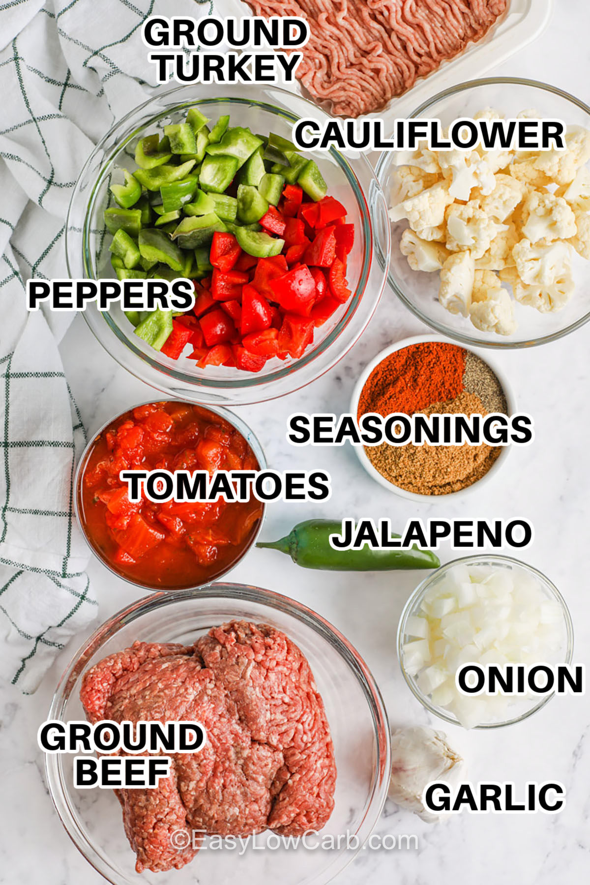 This no-bean low carb chili uses cauliflower to create a thick, satisfying texture while keeping carbs low and flavor high. Ground beef and turkey simmer with tomatoes, chili spices, onions, and peppers to make a cozy and hearty meal. The cauliflower blend adds richness without dairy or thickeners. It’s great for meal prep, reheats well, and is a comforting option for anyone craving classic chili with a lighter twist. #easylowcarb ground turkey , ground beef , tomatoes , onion , garlic , jalapeno , seasonings , cauliflower with labels to make Low Carb Chili