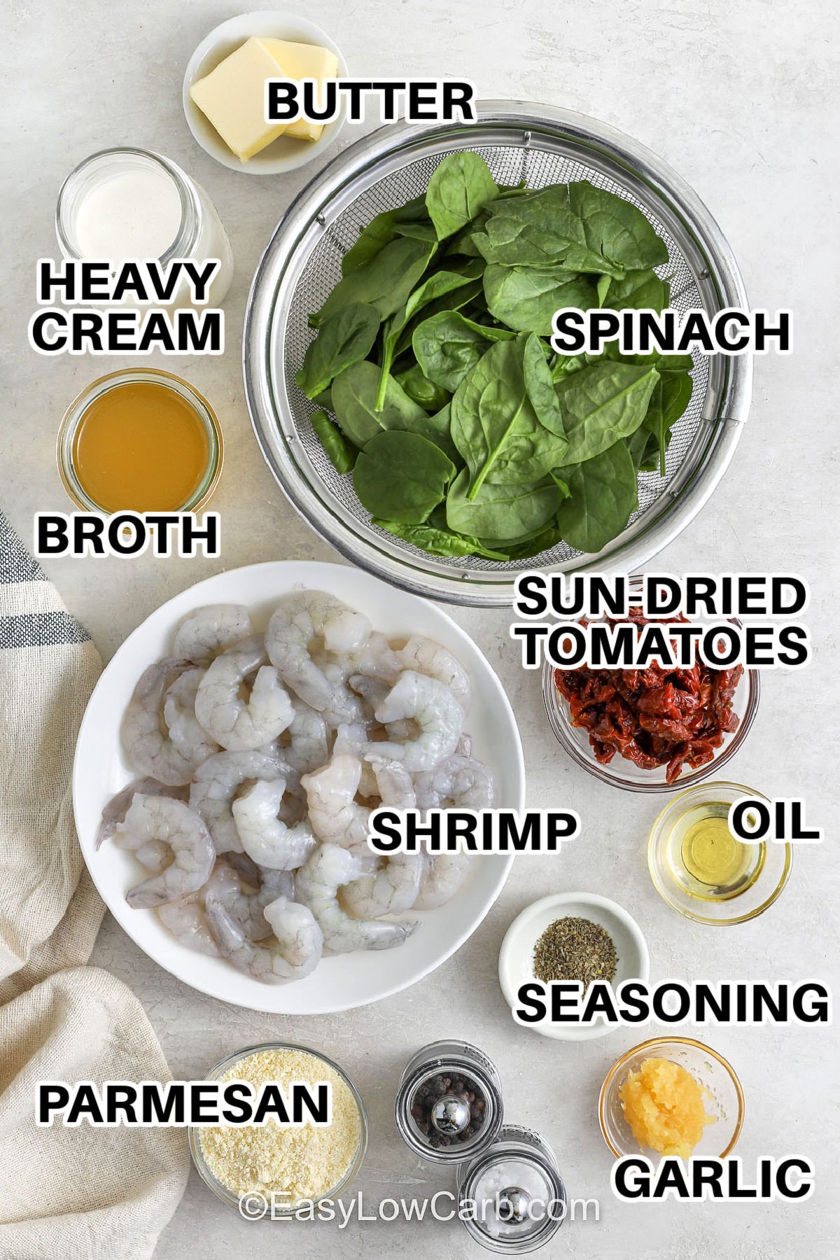 Creamy Tuscan shrimp is a fast one-skillet dinner with juicy shrimp seared in sun-dried tomato oil, then finished in a creamy garlic-Parmesan sauce. Baby spinach wilts right into the pan for a cozy, low carb meal that feels restaurant-worthy. Serve this over zoodles, cauliflower rice, or roasted broccoli for a rich, savory plate with bright tomato flavor. #easylowcarb butter , heavy cream , spinach , broth , sun dried tomatoes , shrimp , oil, seasonings , garlic , parmesan with labels to make Creamy Tuscan Shrimp