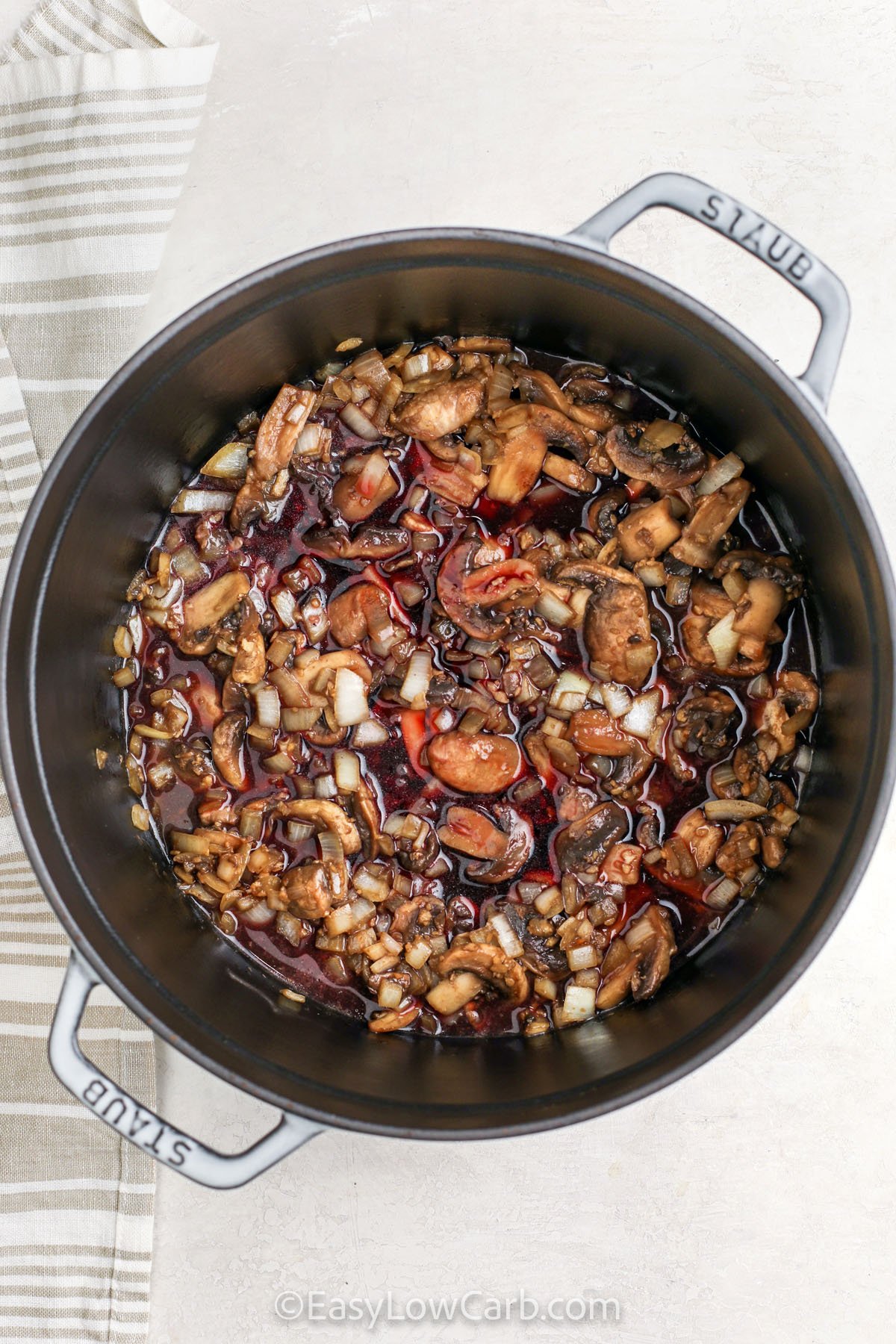 cooking mushrooms and onion to make Low Carb Beef Stew