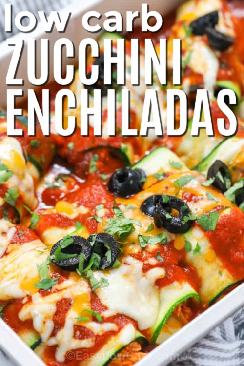 Try these Zucchini Enchiladas for a clever low carb twist on classic chicken enchiladas, with thin ribbons of zucchini substituting for tortillas. Shredded chicken is simmered with enchilada sauce, onion, cumin, and garlic powder, then rolled up with sharp cheddar and Monterey Jack cheese. The rolls bake in a 9 x 13 inch dish until the zucchini is tender and the top is golden and bubbly. Serve with sour cream and cilantro for a cozy, flavor packed dinner. #easylowcarb low carb Zucchini Enchiladas with writing
