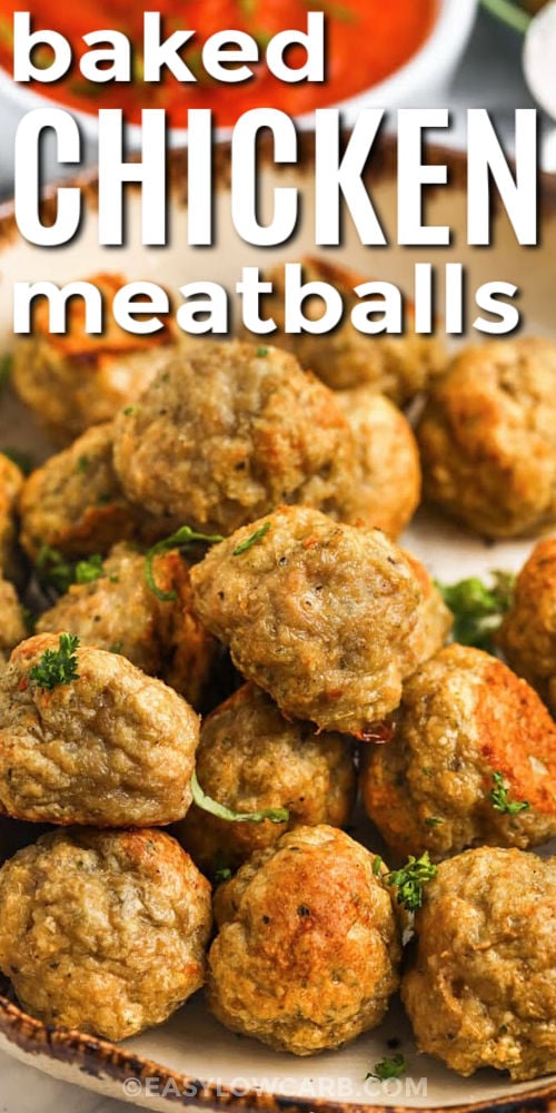 Make these oven baked chicken meatballs on a single sheet pan for a fast, low carb dinner that is easy to clean up. The recipe uses ground chicken, parmesan, garlic, and almond flour to create juicy meatballs with Italian flavor and no breadcrumbs. They are delicious with marinara and veggie noodles or served with roasted vegetables on the side. Freeze extras for later, and you will always have a simple protein ready to go. #easylowcarb plated Chicken Meatballs with writing