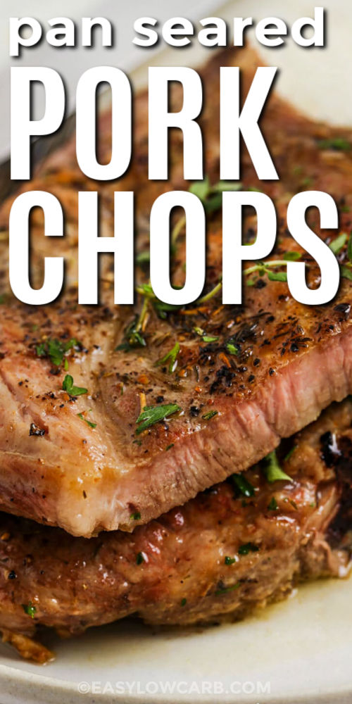 Learn how to make cast iron pork chops that stay tender with this easy pan seared pork chops recipe. The chops are seasoned with salt, pepper, and herbs, then seared until golden before finishing gently in the oven. A final spoonful of herb butter over the top adds flavor and moisture, making this low carb dish a great base for simple vegetable sides or cauliflower rice. #easylowcarb close up of Pan Seared Pork Chops with writing