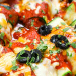 zesty Zucchini Enchiladas in the dish with a title