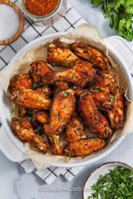 top view of cajun wings in a white bowl