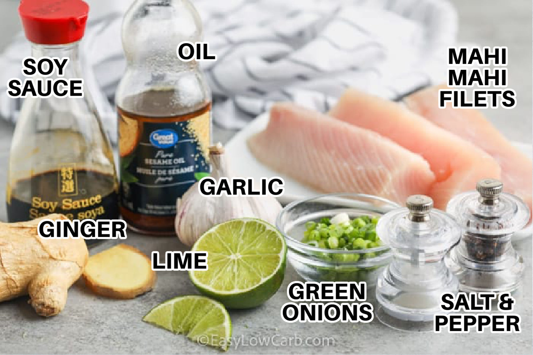 Save this baked mahi mahi recipe for busy nights when you want big flavor without extra cleanup. Mahi mahi fillets soak in a soy lime garlic marinade with ginger and sesame, then bake in the same dish until juicy and flaky. A sprinkle of sesame seeds and sliced green onions adds crunch and freshness. Pair with roasted asparagus or a crisp salad for a low carb meal. #easylowcarb soy sauce , oil , ginger , garlic , lime , green onions , mahi mahi filets , salt and pepper with labels to make Baked Mahi Mahi Recipe