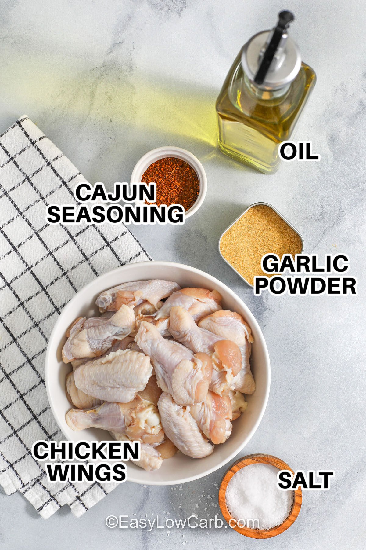 These Cajun wings cook up crispy and flavorful with a simple Cajun dry rub and a quick air fryer method. Patting the wings dry helps the skin brown and crisp, while the olive oil keeps the seasoning evenly coated. The garlic and Cajun seasoning bring bold, savory heat without any breading, making this a great low carb chicken wings option for weeknights or game day. #spendwithpennies cajun wings labelled ingredients