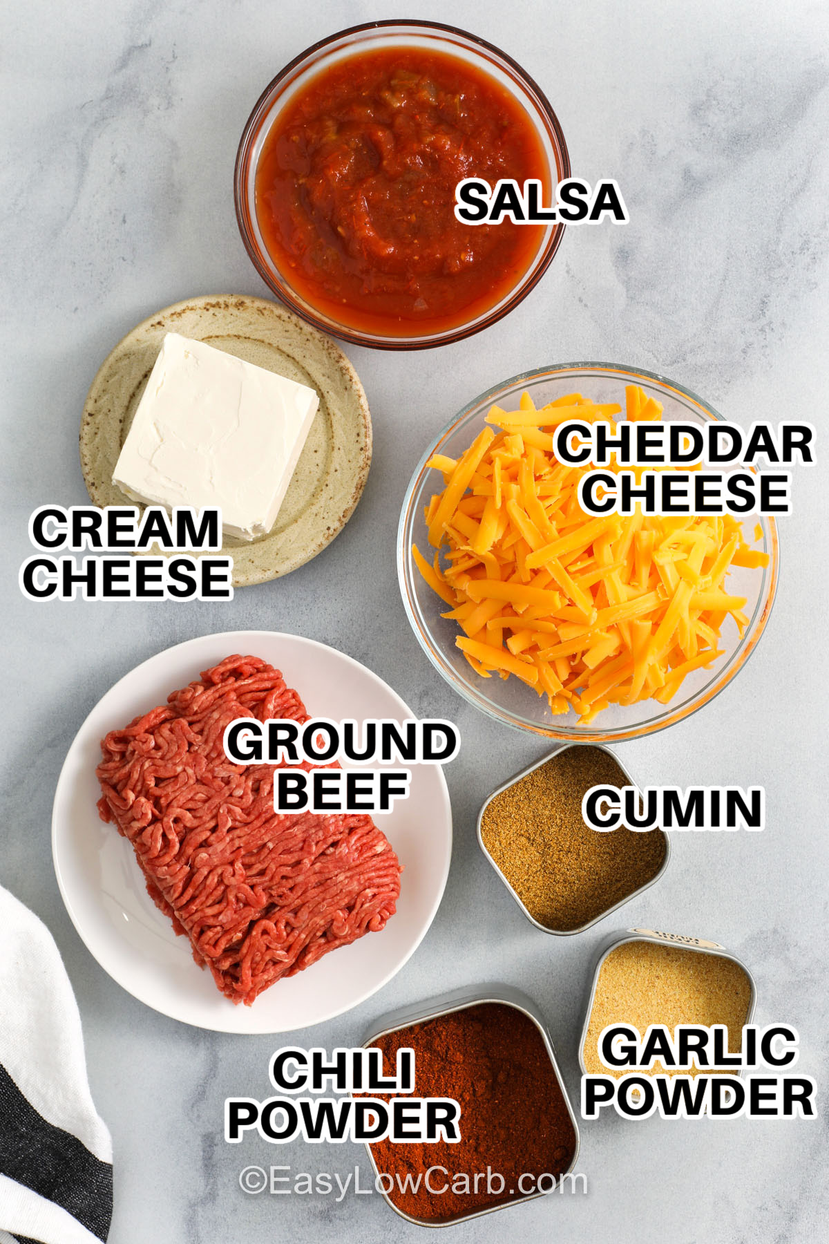 If you want a quick appetizer, this Chili Cheese Dip delivers big flavor with simple ingredients. Ground beef is cooked and drained, spices bloom in the pan, then salsa and cream cheese melt into a silky sauce. Cheddar is stirred in last for a creamy, cheesy finish that clings to every chip. Adjust the heat with mild or hot salsa, then add jalapeños or green chiles for extra kick if you like. #easylowcarb salsa , cheddar cheese , cream cheese , ground beef, chili powder, cumin, garlic powder with labels to make Chili Cheese Dip