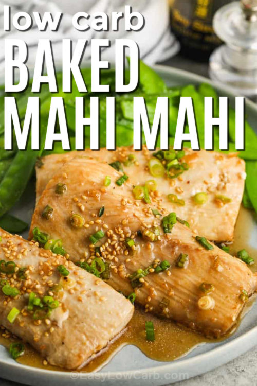 This baked mahi mahi recipe is simple but tastes special thanks to sesame oil, fresh ginger, and lime. Marinate the fillets briefly, then bake in a snug dish so the sauce stays pooled and glossy. The result is flaky, tender fish with a savory glaze you can spoon over every bite. Garnish with sesame seeds and green onions, then serve with zoodles or cauliflower rice. #easylowcarb plated Baked Mahi Mahi Recipe with writing