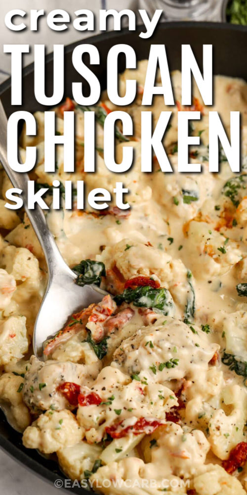 This creamy Tuscan chicken skillet with cauliflower is a simple one-pan dinner for busy nights. Seasoned chicken pieces get a quick sear, then simmer in a heavy cream sauce with Parmesan, sun-dried tomatoes, and spinach. Cooking the cauliflower first keeps the skillet from turning watery and helps it soak up flavor. Reheat gently on low heat with a splash of broth or cream for the best texture. #easylowcarb creamy tuscan skillet in a pan with a spoon and writing