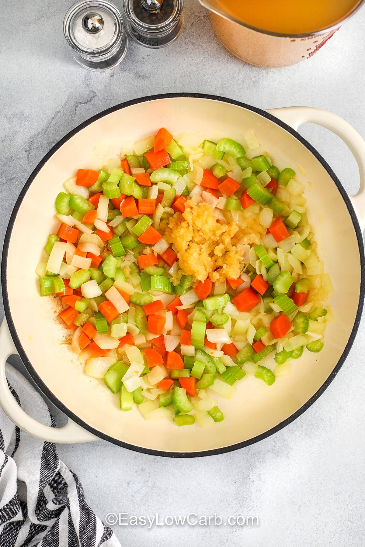 This buffalo chicken soup delivers bold wing flavor in a cozy, creamy bowl. A blended cauliflower base thickens the broth without flour, while cream cheese adds a smooth, rich texture. Stir in shredded chicken and buffalo sauce at the end so the chicken stays tender and the heat tastes fresh. Top with blue cheese or cheddar and green onions for a classic finish that feels restaurant-worthy. #easylowcarb adding garlic and vegetables to make Buffalo Chicken Soup