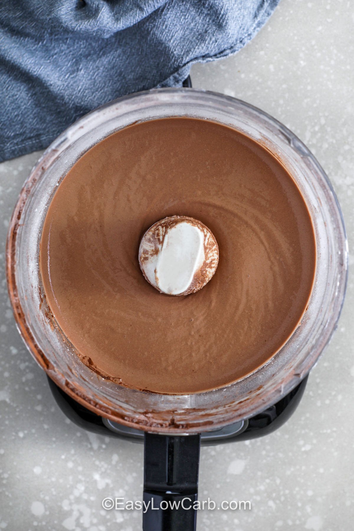 Make cottage cheese chocolate mousse when you want a fast, high-protein chocolate dessert with zero baking. Blend cottage cheese with cocoa powder and powdered erythritol and monkfruit until completely smooth, scraping the bowl so no cocoa clumps remain. Chill for a thicker mousse texture, then top with raspberries or a drizzle of sugar free syrup. It tastes rich like pudding but feels light. #easylowcarb Cottage Cheese Chocolate Mousse in a blender