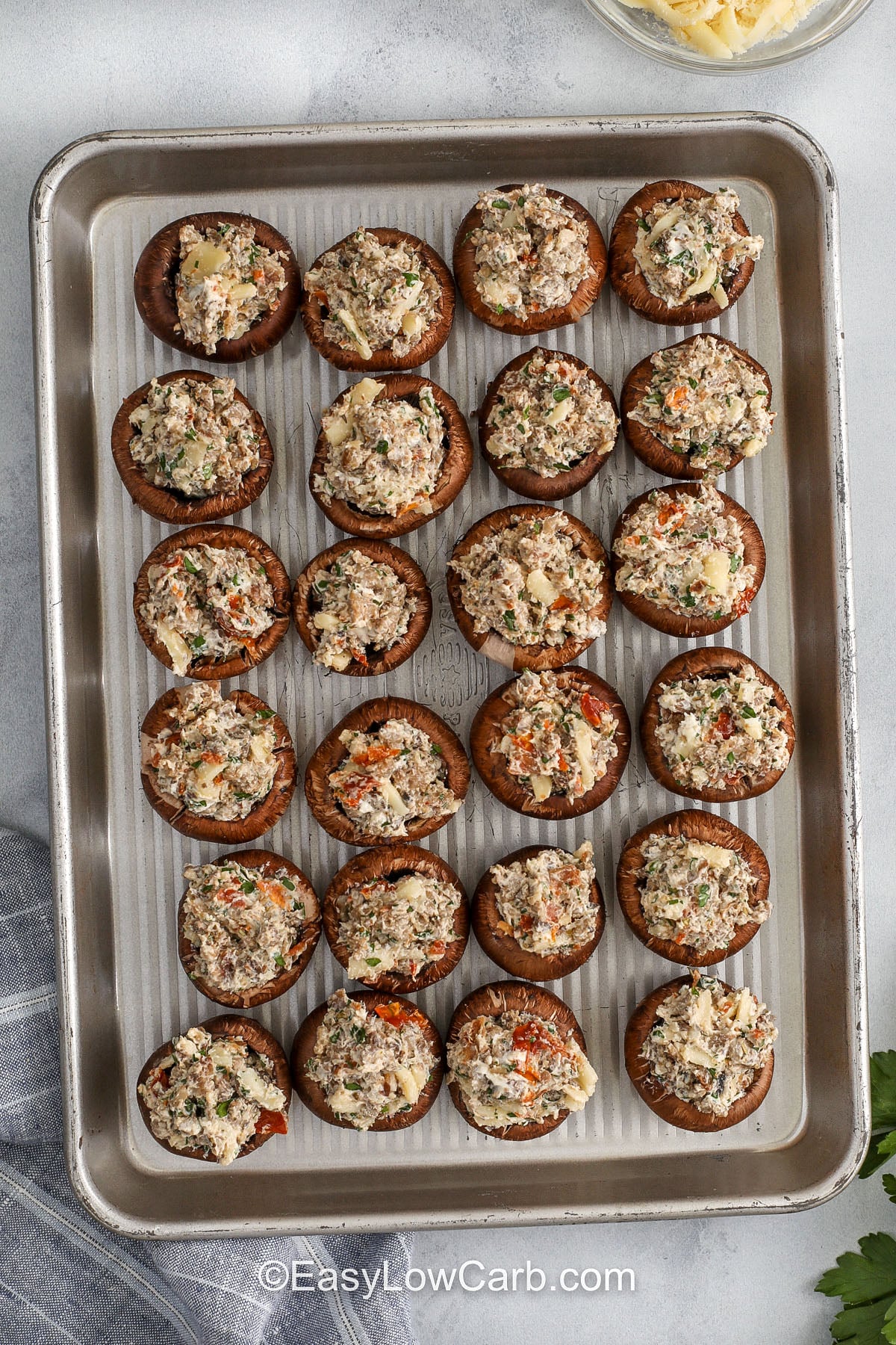 Keto Stuffed Mushrooms on a sheet pan before cooking