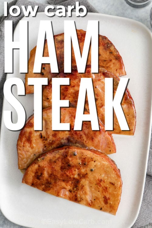 This ham steak recipe is quick, hearty, and perfect for a low carb dinner rotation. Ham steaks cook fast, so the key is a flavorful glaze: Dijon mustard, butter, apple cider vinegar, garlic powder, and low carb brown sugar sweetener. The glaze melts into a glossy sauce that clings to the ham and makes simple sides taste better. Serve with roasted veggies or a creamy cauliflower side for comfort food vibes. #easylowcarb low carb Ham Steak on a plate with writing