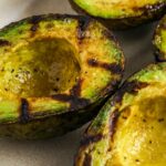 Cropped image of Grilled avocados