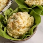 Keto egg salad prepared and being served in a lettuce cup