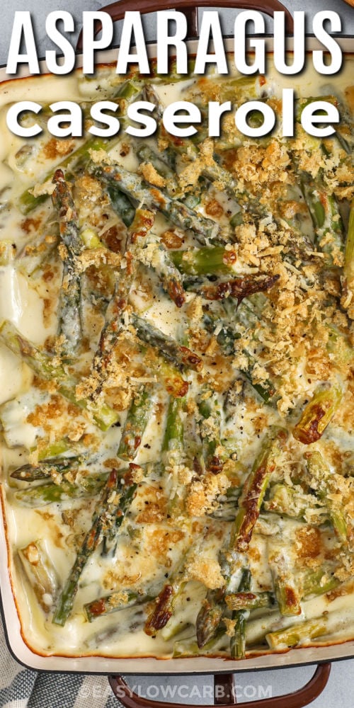 This cheesy asparagus casserole is a simple way to turn fresh asparagus into a crowd-pleasing side. A quick stovetop sauce with garlic, cream cheese, and heavy cream turns smooth and rich, then cheddar and parmesan melt in for deep flavor. Sprinkle crushed pork rinds on top for a crisp, browned finish. It is keto-friendly, gluten free, and great for meal prep. #easylowcarb casserole dish of delicious Asparagus Casserole with writing