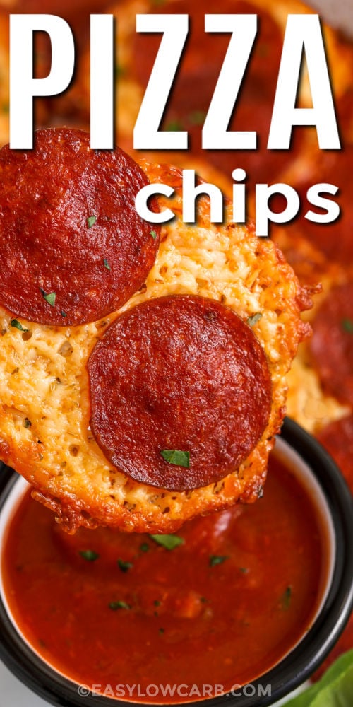 Pizza chips are baked mozzarella cheese crisps topped with pepperoni and Italian herbs, and they are perfect for dipping. Use finely shredded mozzarella so the chips melt evenly, then bake until the edges are deeply golden for the best crunch. Cooling time is key because it sets the cheese into a crisp texture. Serve with low carb marinara sauce, ranch, or a creamy dip for an easy keto-friendly appetizer. #easylowcarb close up of dipping Pizza Chips in marinara with a title