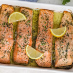 Garlic Butter Shrimp prepared in a casserole dish and topped with lemon slices
