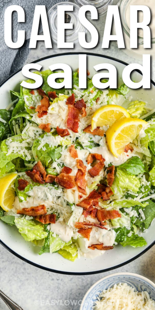 Keto Caesar salad is a fresh and easy low-carb salad made with crisp lettuce, bacon, and a creamy Caesar dressing. This keto salad recipe is perfect for meal prep, quick lunches, or light dinners that still feel satisfying. The homemade dressing uses simple ingredients like lemon, garlic, and Parmesan for bold flavor. Add chicken or shrimp to make it a complete keto-friendly meal. #easylowcarb top view of Low Carb Caesar Salad in a bowl with writing