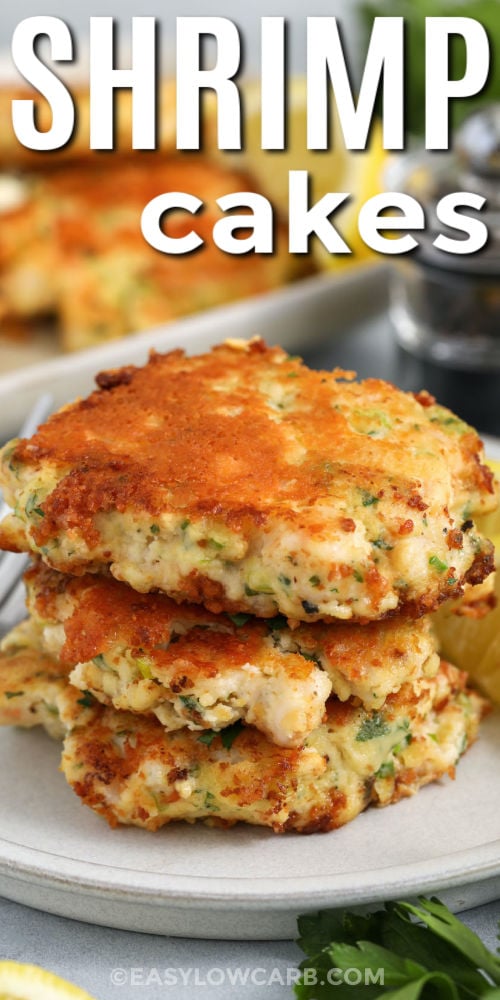 If you need an easy seafood dinner, these low carb shrimp cakes are a great choice. They are pan-fried in butter and oil for golden edges and a savory finish, with green onion and parsley adding fresh flavor. Almond flour or keto breadcrumbs both work, so the recipe is flexible and easy to adapt with what you have. Add lemon aioli for a bright, creamy dip. #easylowcarb stack of Shrimp Cakes with a title