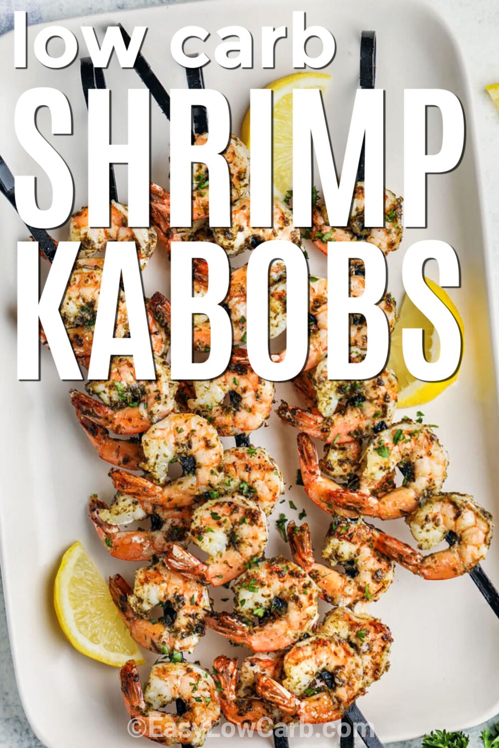 Shrimp kabob recipe lovers will want to add these colorful skewers to the menu. Juicy shrimp and fresh vegetables are seasoned and grilled for a meal packed with flavor. These grilled shrimp skewers are perfect for summer dinners and backyard cookouts. They pair beautifully with salads and other low carb sides. Every bite is bright, satisfying, and easy to enjoy. Save this easy seafood dinner for busy nights and family gatherings. Make these tasty skewers for your next meal. #easylowcarb low carb Grilled Shrimp Kabobs on a plate with writing