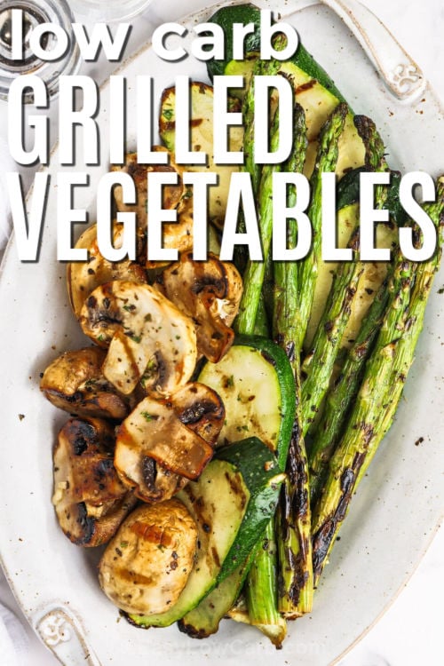 Summer meals get an upgrade when this grilled vegetables recipe is on the menu. Fresh zucchini, mushrooms, and asparagus are tossed in a balsamic garlic marinade, then grilled until tender with smoky caramelized edges. The flavor is savory, bright, and perfect for pairing with chicken, steak, or seafood. This healthy side dish is great for BBQs, cookouts, or easy weeknight dinners. Make this simple veggie recipe for your next grill night. #easylowcarb low carb Grilled Vegetables Recipe with writing