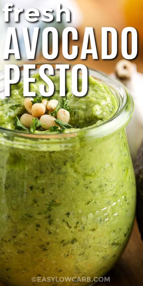 Avocado pesto is perfect when you want a creamy sauce without a heavy cream base. Ripe avocado blends with basil, garlic, olive oil, lemon juice, parmesan, and pine nuts for a smooth sauce that tastes fresh and satisfying. It is a great low carb recipe for lunches, quick dinners, vegetable platters, lettuce wraps, and easy protein bowls. #easylowcarb fresh Avocado Pesto in a jar with a title