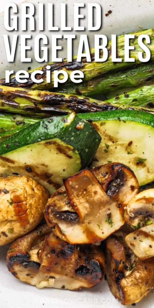 Nothing beats a grilled vegetables recipe that brings bold flavor with simple ingredients. This one features zucchini, mushrooms, and asparagus coated in a garlic balsamic marinade before being grilled to perfection. The veggies come out tender with a light char that adds rich smoky taste. It is a healthy side dish that fits perfectly with any grilled main course or summer gathering. Try this easy recipe for your next family meal. #easylowcarb close up of Grilled Vegetables Recipe on a plate and writing