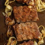 Oven Baked Ribs on a sheet pan with onions and a title