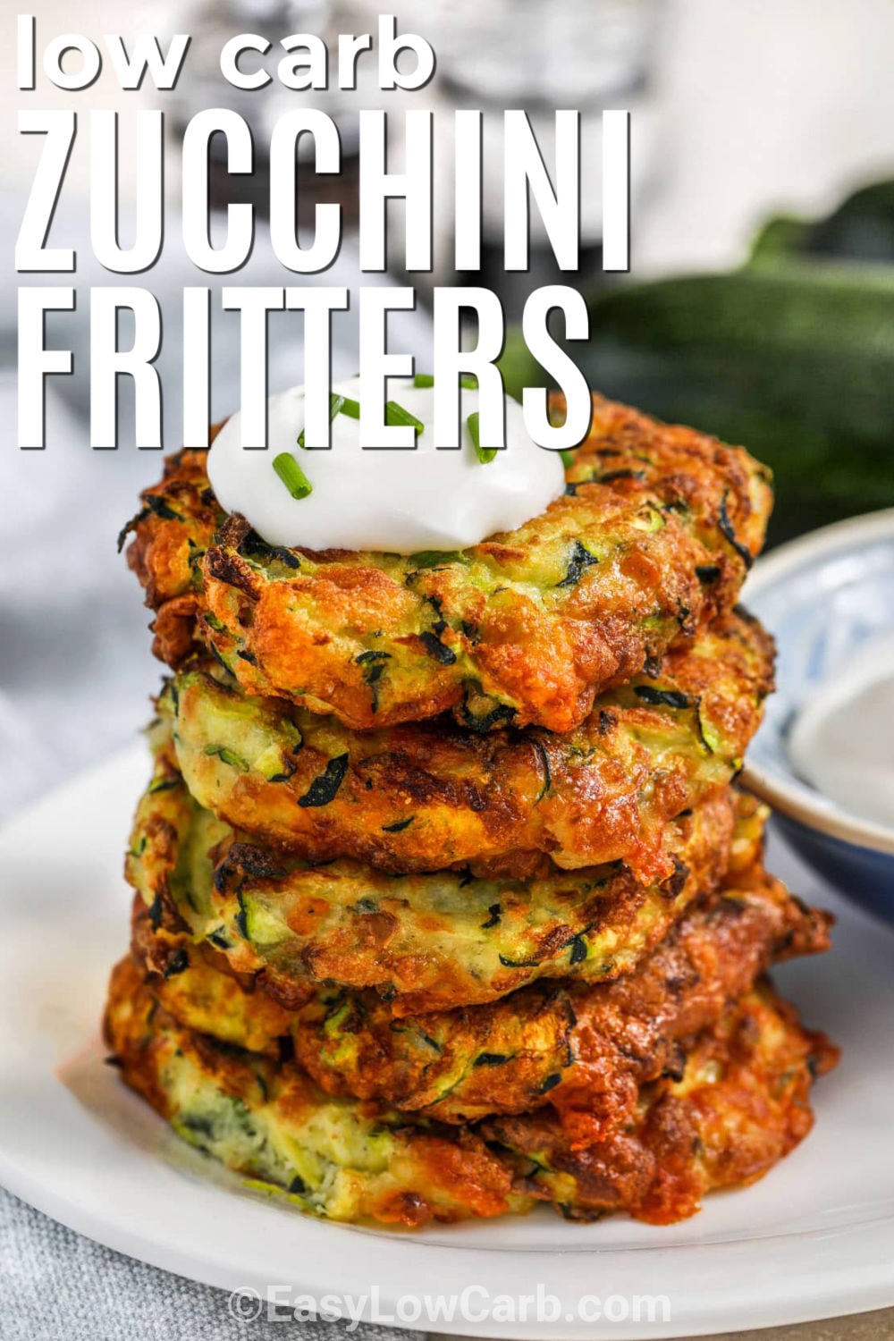 This zucchini fritter recipe is a tasty way to enjoy fresh zucchini with simple ingredients. Each fritter is golden on the outside with a cheesy center that everyone will love. Almond flour keeps them low-carb while mozzarella and Parmesan add plenty of savory flavor. Serve them as a snack, side dish, or light lunch with your favorite dipping sauce. Save this recipe and make it part of your meal plan. #easylowcarb low carb Zucchini Fritters with writing