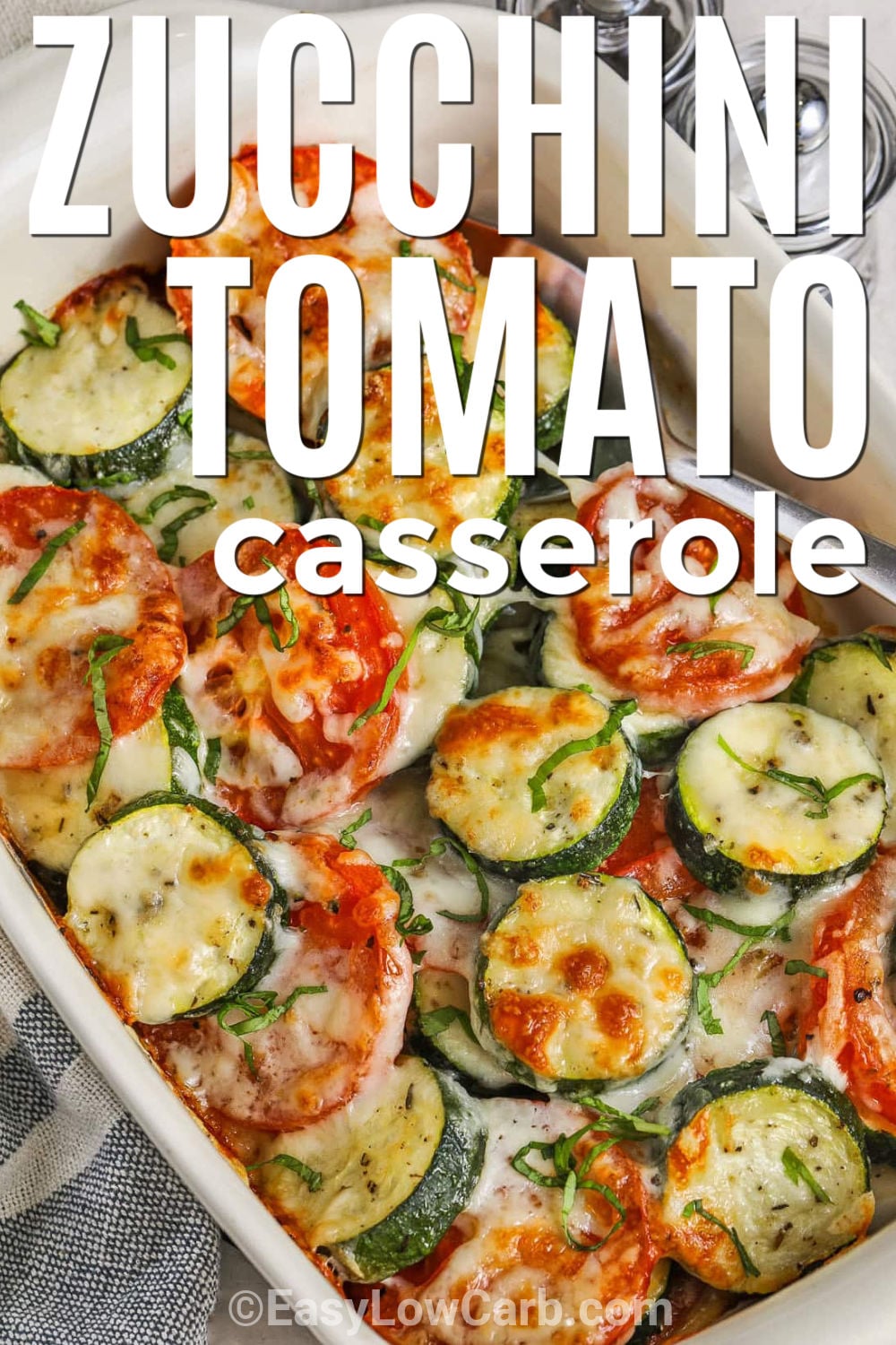 Make this zucchini tomato casserole when you want a fresh vegetable side that still feels warm and comforting. Thick zucchini slices and juicy Roma tomatoes are tossed with olive oil and Italian herbs, then baked under mozzarella and parmesan cheese. It is low carb, simple to prepare, and a delicious way to use garden zucchini or market tomatoes without breadcrumbs or heavy sauce. Pin it now for zucchini season. #easylowcarb cheesy Zucchini Tomato Bake with writing