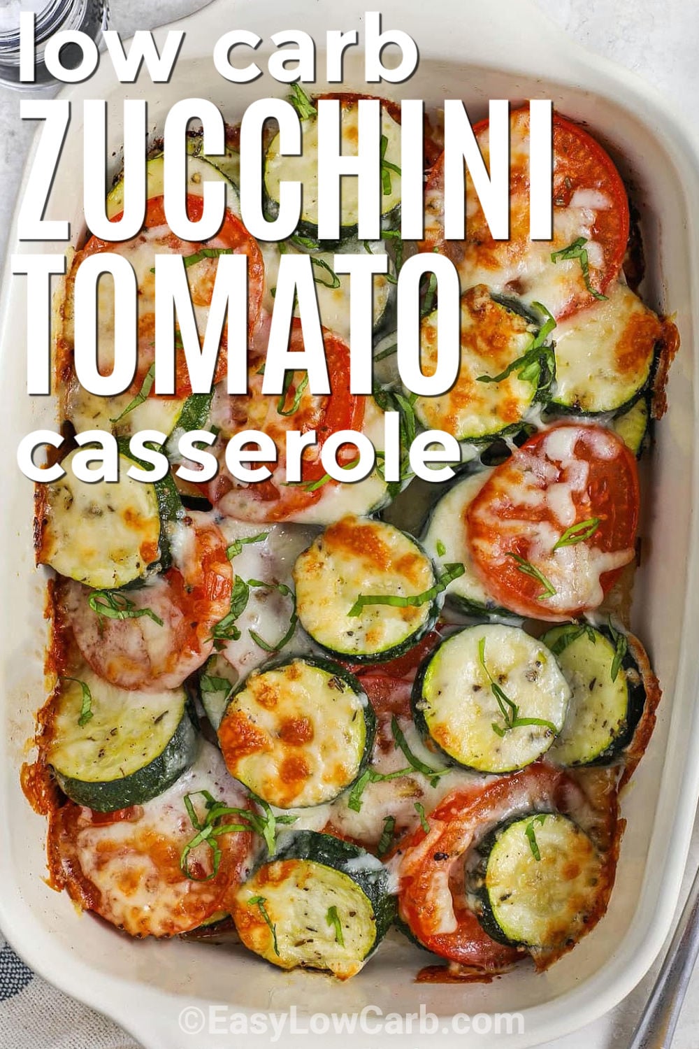Serve this zucchini tomato casserole with chicken, steak, pork, fish, or a crustless quiche for an easy low-carb meal. The zucchini bakes until tender, the tomatoes add bright flavor, and the cheese topping makes the whole dish feel satisfying without pasta or breadcrumbs. It is a simple recipe to save for summer dinners, holiday sides, or anytime you need more vegetables. Pin this simple casserole for later. #easylowcarb low carb Zucchini Tomato Bake with writing