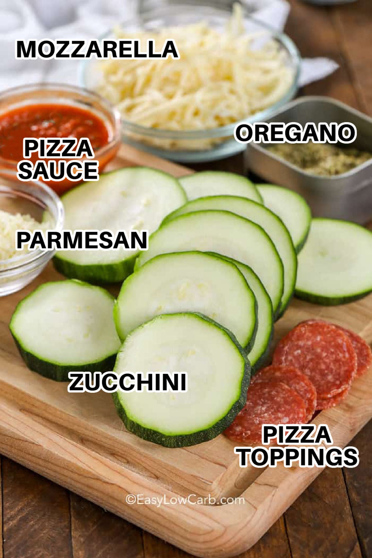 Mini zucchini pizzas turn plentiful garden vegetables into a warm and cheesy snack the whole table can customize. Top evenly sliced zucchini with tomato sauce, dried oregano, mozzarella, Parmesan, and small pieces of pepperoni or cooked vegetables. Baking softens the zucchini, while a brief broil browns the cheese. Add these zucchini pizza bites to a low carb snack board and save the recipe for later. #easylowcarb mozzarella , pizza sauce , parmesan , oregano , zucchini , pizza toppings with labels to make Zucchini Pizza Bites