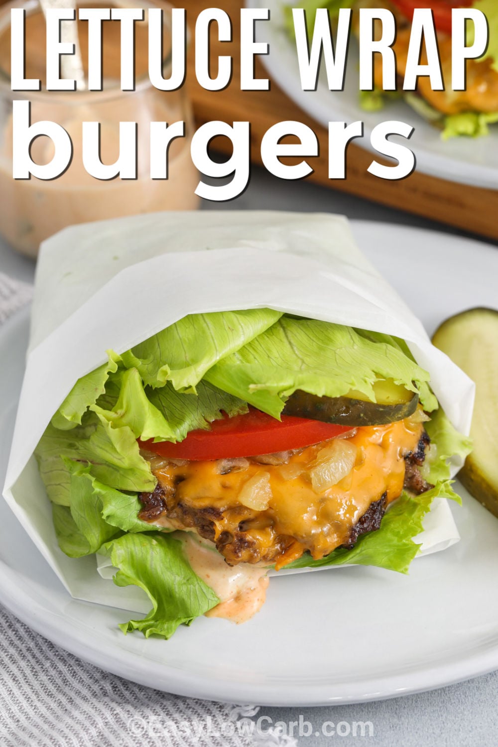 Make a lettuce wrap burger with thin ground beef patties cooked in a very hot cast-iron skillet for crisp, deeply browned edges. Add cheddar or American cheese, tangy pickles, sliced tomato, and a quick homemade burger sauce before wrapping everything in sturdy lettuce leaves. The toppings can be prepared ahead, and the burgers cook in only a few minutes. Add this flavorful bunless burger to your weeknight dinner board. #easylowcarb Lettuce Wrap Burger with writing