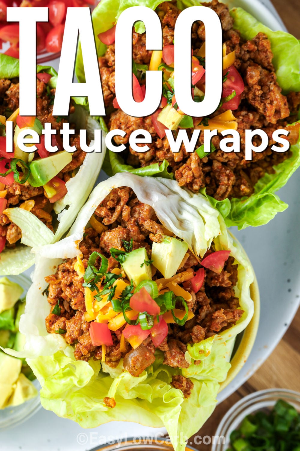 Taco lettuce wraps bring all the savory flavor of classic tacos in a fresh, low carb meal everyone can enjoy. Seasoned ground beef is simmered with taco seasoning and salsa, then tucked into crisp lettuce leaves for the perfect bite. Set out a variety of toppings so everyone can build their own favorite combination. Save this easy recipe and make it again soon. #easylowcarb top view of Taco Lettuce Wraps on a plate with writing