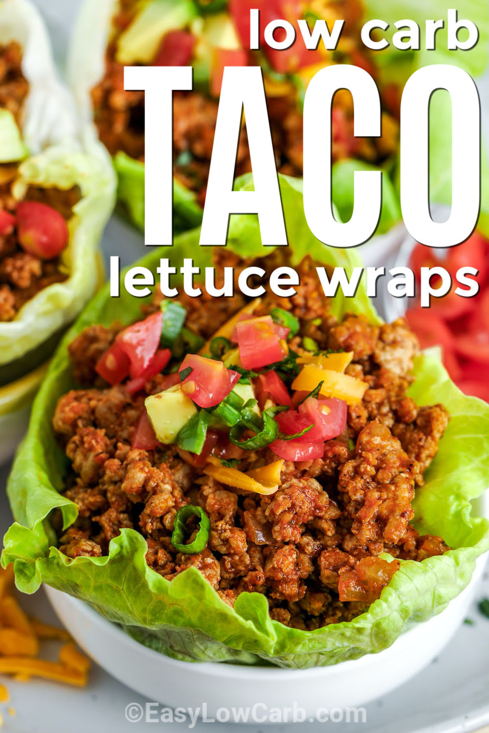 Taco lettuce wraps are a fresh and flavorful way to enjoy taco night without the extra carbs. Each crisp lettuce leaf is filled with seasoned beef, salsa, and your favorite toppings like cheese, avocado, olives, and sour cream. They are perfect for busy weeknights, family dinners, or a lighter meal that still delivers bold taco flavor. Add your favorite toppings and make them your own. Try them for your next taco night. #easylowcarb low carb Taco Lettuce Wraps in bowls with writing