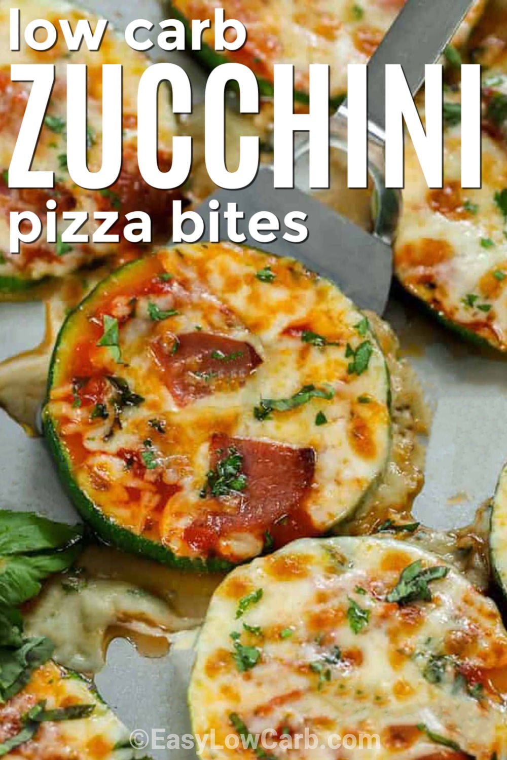 Zucchini pizza bites are a quick and satisfying way to enjoy classic pizza flavor without pizza dough. Fresh zucchini rounds are topped with low-carb pizza sauce, oregano, mozzarella, parmesan, and favorite toppings, then baked and broiled until tender and bubbly. Serve these easy bites as a warm appetizer, an after-school snack, or a vegetable side. Save this zucchini pizza bites recipe for the next time a fast, cheesy snack is needed. #easylowcarb low carb Zucchini Pizza Bites with writing