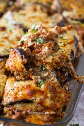 taking a piece of Eggplant Lasagna out of the dish