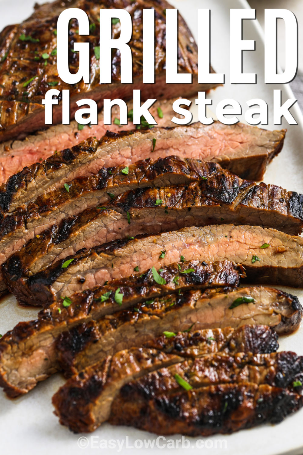 Grilled flank steak is an easy way to bring big flavor to the dinner table. A simple marinade made with balsamic vinegar, soy sauce, garlic, and herbs makes every bite delicious. Grill the steak to your favorite doneness, then let it rest before slicing across the grain. Serve it with grilled vegetables, cauliflower mash, or a fresh salad. Leftovers are perfect for wraps and bowls. Give this easy low-carb dinner a try tonight. #easylowcarb sliced Grilled Flank Steak with a title