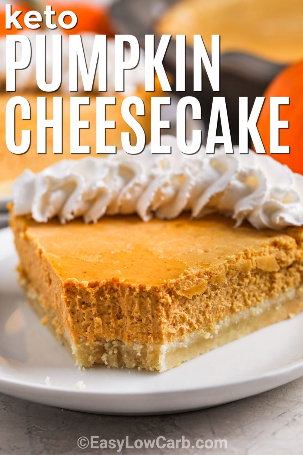 Keto pumpkin cheesecake combines smooth cream cheese, canned pumpkin, sour cream, cinnamon, and pumpkin pie spice in a rich filling that tastes just right for fall. A buttery almond flour crust adds a lightly nutty texture while keeping the dessert low carb. Bake it in a deep-dish pie plate, chill it thoroughly, and serve with sugar-free whipped cream or toasted pecans. Save this easy fall dessert for your next holiday menu. #easylowcarb Keto Pumpkin Cheesecake slice with a bite taken out and writing.