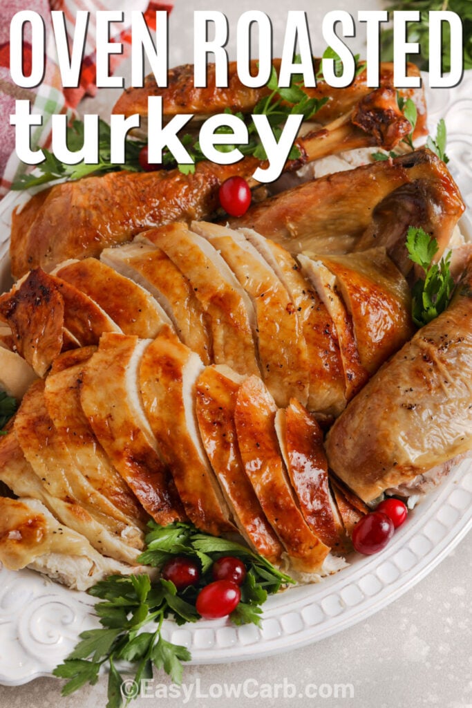 Learn how to make and oven roasted turkey using a simple method that delivers classic flavor without extra fuss. This easy roast turkey is brushed with butter or oil and paired with garlic, fresh poultry herbs, celery, onion, and broth before roasting until tender and golden. The recipe feeds a crowd and the cooked meat can be portioned for low carb leftovers after the holiday meal. Pin this turkey recipe for easy holiday planning. #easylowcarb plate of Oven Roasted Turkey and cranberries with writing.