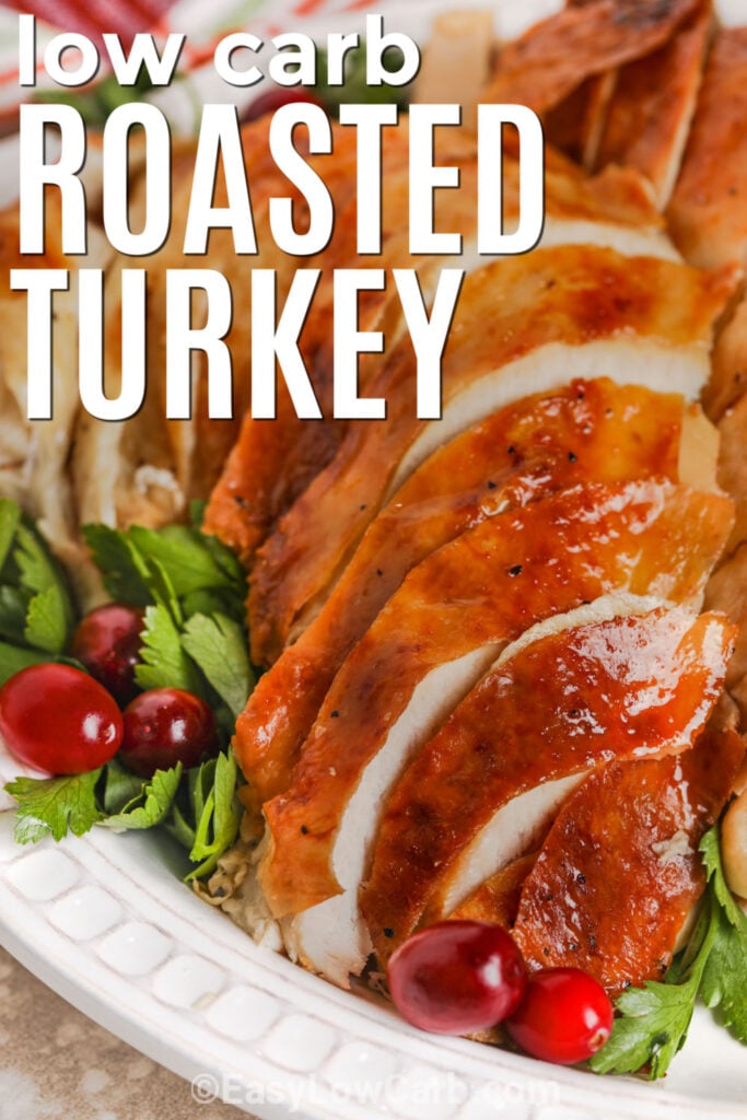 This Thanksgiving oven roasted turkey is all about familiar savory flavor, tender meat, and beautifully browned skin. Fresh poultry herbs, onion, garlic, and celery add traditional flavor while the whole turkey slowly roasts in the oven over a pan of broth and aromatics. With only 15 minutes of prep, it is a practical low carb holiday centerpiece that lets the oven handle most of the work. Save this recipe for Thanksgiving dinner. #easylowcarb juicy Oven Roasted Turkey with writing.