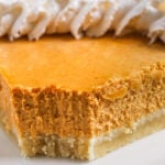 close up of Keto Pumpkin Cheesecake with a bite taken out