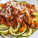 close up of Zucchini Spaghetti with sauce and parmesan on top